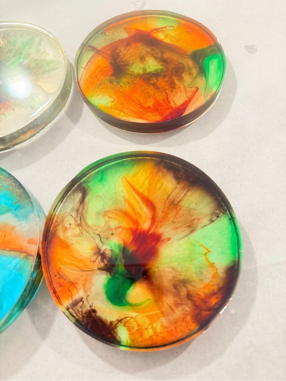 Handmade Resin Coaster with Swirl of Orange, Green and Red